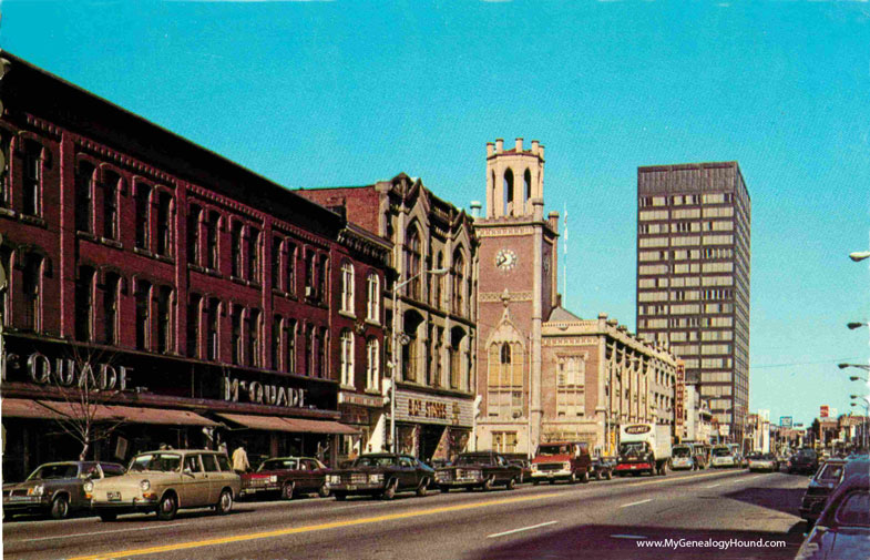 McQuade store building at the left on Elm Street, Manchester, New Hampshire, vintage postcard, photo